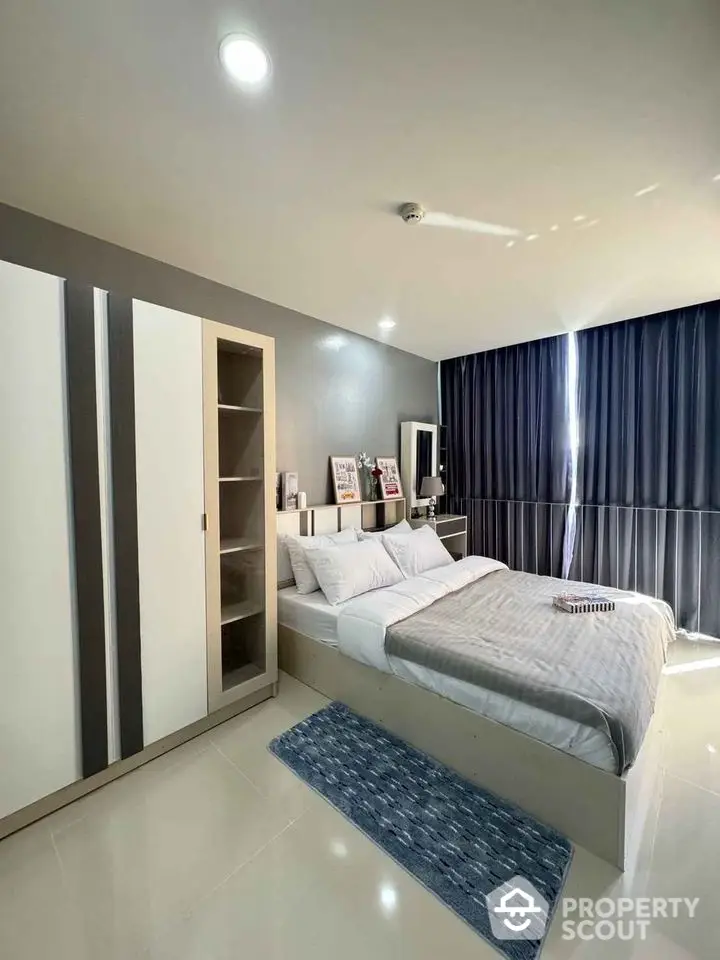 Modern bedroom with sleek design and ample natural light