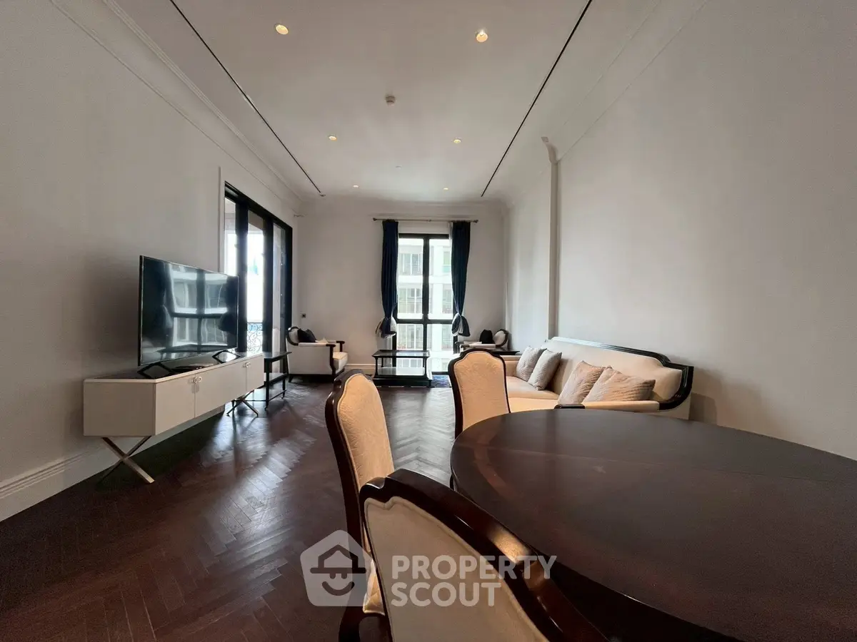 Elegant living room with dark wood flooring and modern furniture
