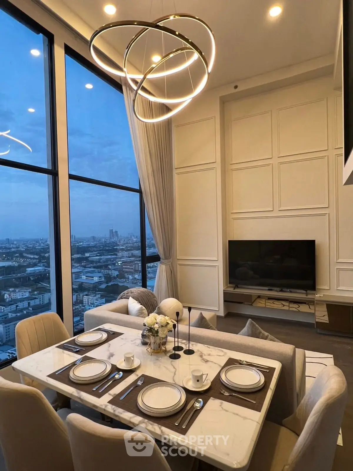 Luxurious high-rise living room with stunning city view and modern decor