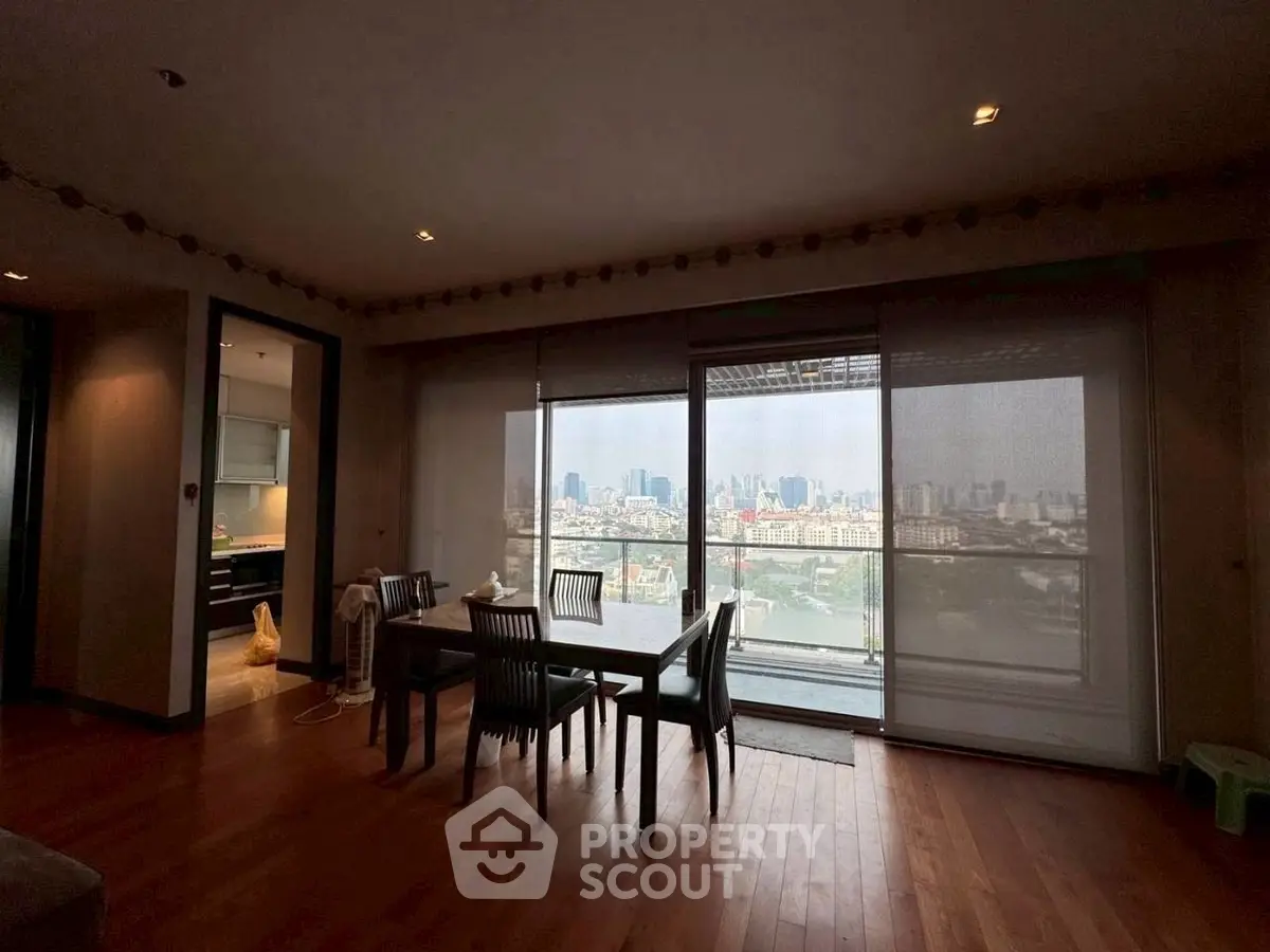 Spacious dining area with stunning city view through large windows