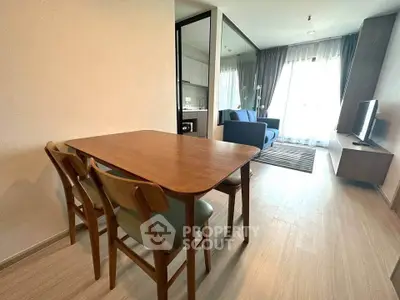 Modern open-plan living room with dining area and stylish furniture