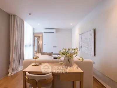 Elegant living room with modern decor and natural light, featuring a cozy seating area and stylish furniture.