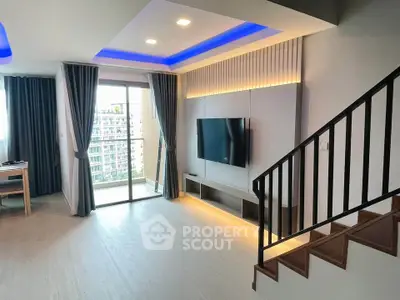 Modern living room with sleek design, LED lighting, and balcony view in a high-rise apartment.