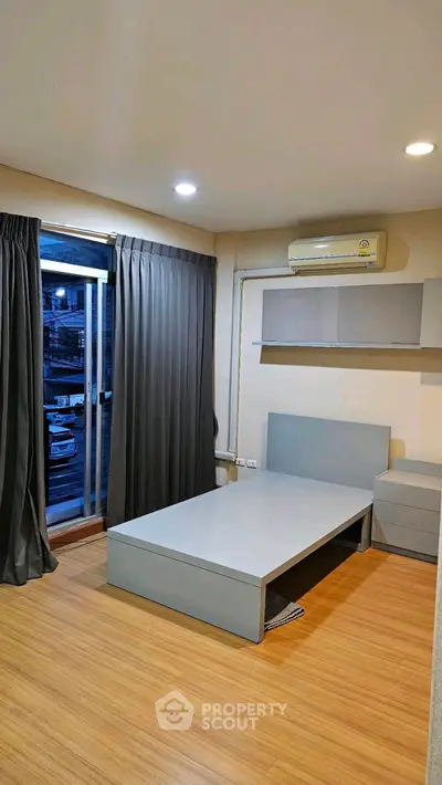 Modern bedroom with minimalist design and large window view