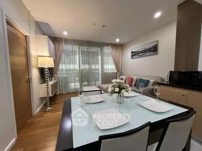 Modern living room with elegant dining area and large window view