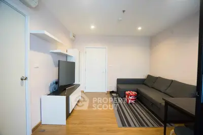 Modern living room with sleek furniture and stylish decor in a cozy apartment.