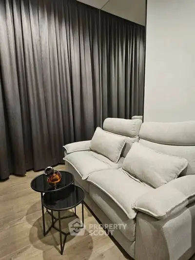 Modern living room with stylish sofa and elegant curtains