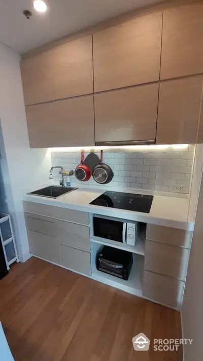 Modern kitchen with sleek cabinetry and built-in appliances