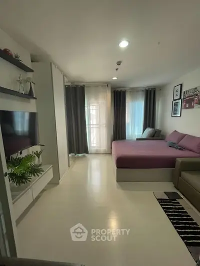 Modern studio apartment with cozy bed and stylish decor