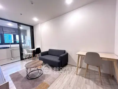 Modern living room with sleek furniture and natural light, perfect for urban living.