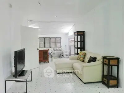 Spacious living room with modern decor and comfortable seating