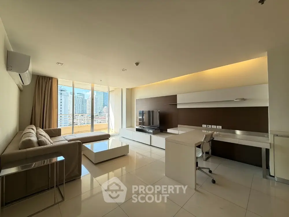 Spacious modern living room with city view and sleek furniture
