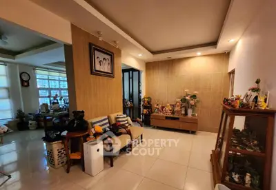 Spacious living area with modern decor and ample natural light