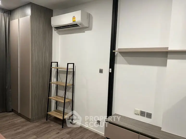 Modern minimalist interior with air conditioning and shelving unit