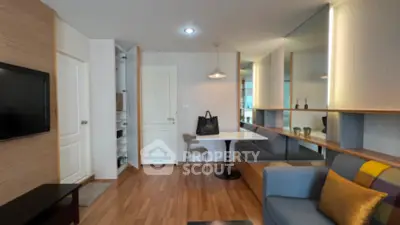 Modern living room with stylish decor and built-in storage solutions.
