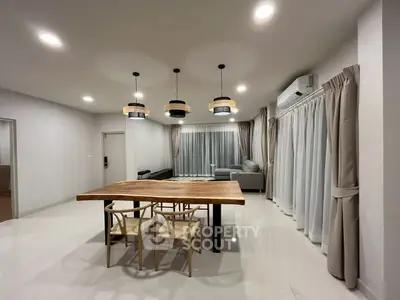 Spacious modern living room with elegant lighting and stylish furniture