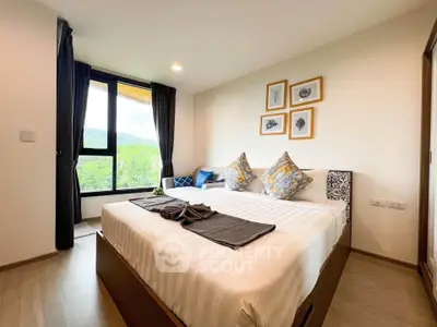 Cozy bedroom with scenic window view and stylish decor