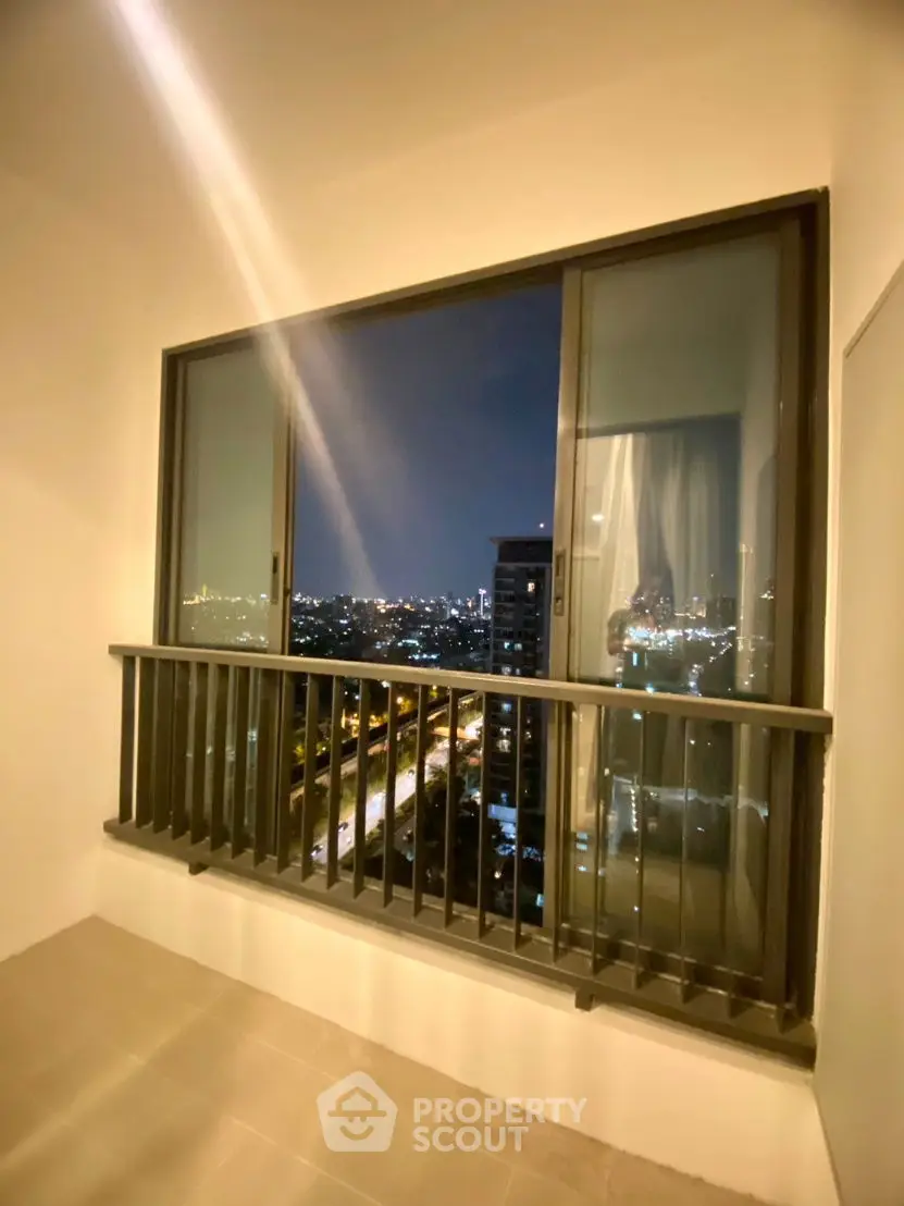 Stunning city view from a modern balcony at night, perfect for urban living.