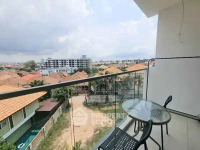 Spacious balcony with stunning city view in modern apartment