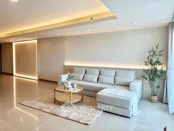 Spacious modern living room with elegant sofa and stylish decor