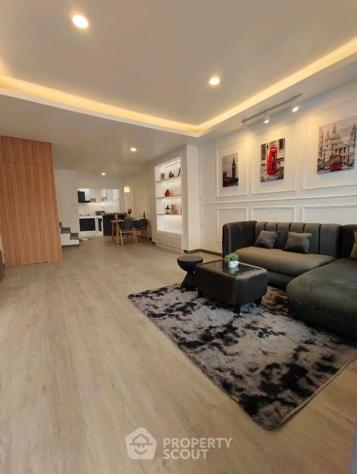 Spacious modern living room with open kitchen and stylish decor