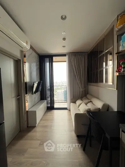 Modern living room with balcony view and sleek interior design