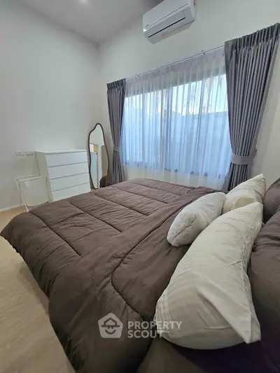 Cozy bedroom with modern decor and natural light