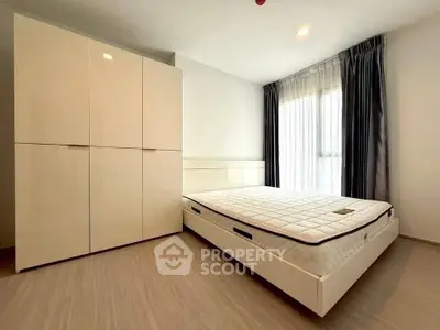 Spacious modern bedroom with large wardrobe and natural light