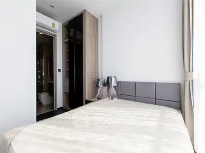 Modern bedroom with sleek design and ample natural light