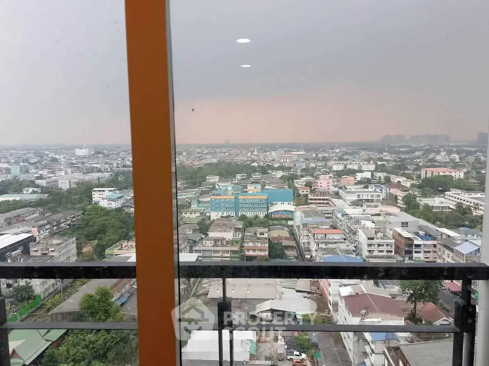 Stunning cityscape view from high-rise balcony with expansive urban panorama.