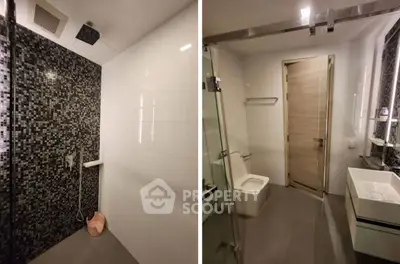 Modern bathroom with sleek design, featuring a glass shower and contemporary fixtures.