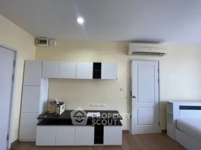 Modern living room with sleek furniture and air conditioning in a cozy apartment.