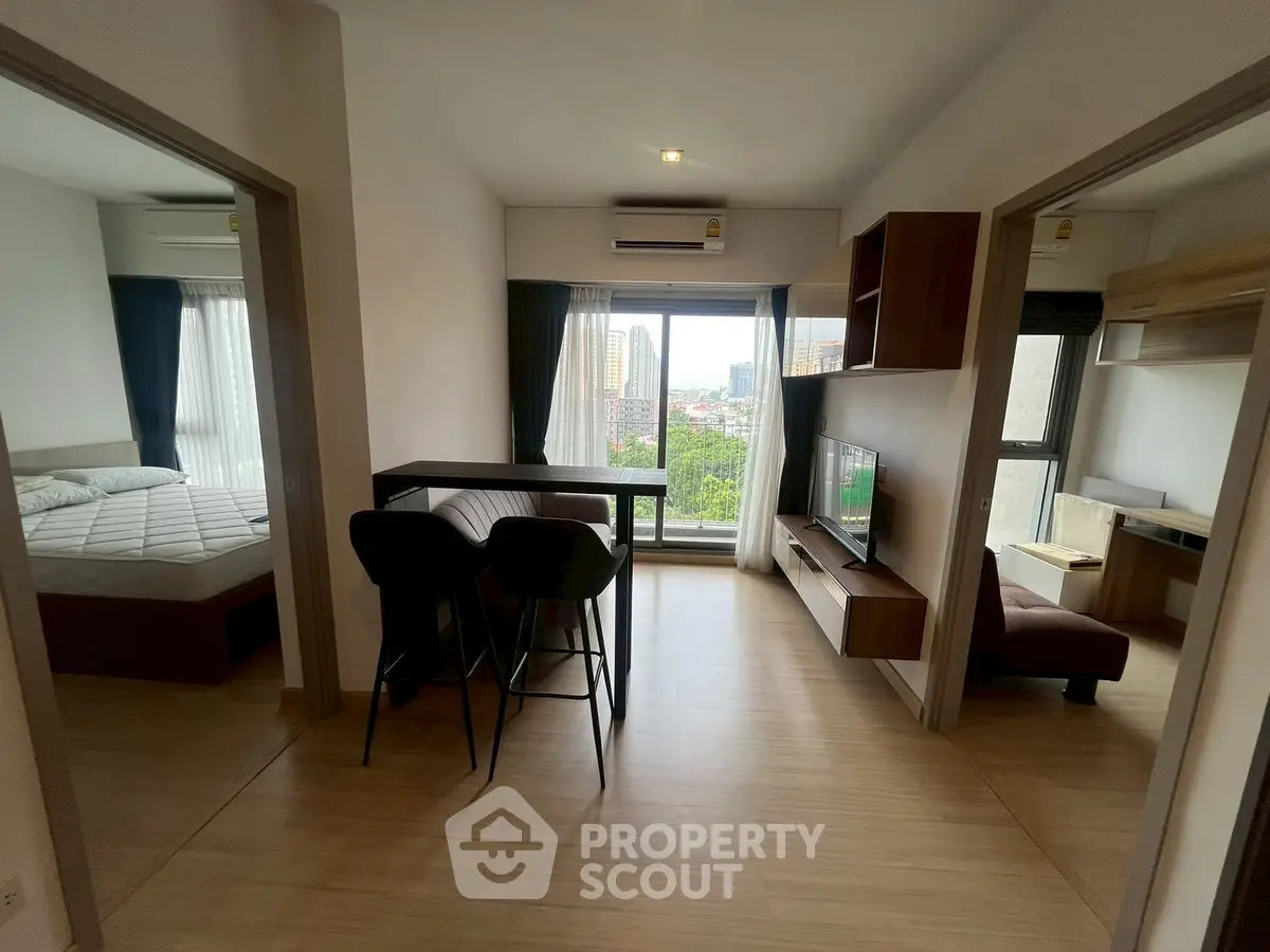 Modern apartment interior with open living area and city view