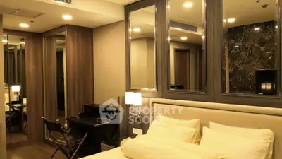 Luxurious bedroom with elegant decor and mirrored accents