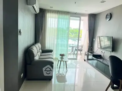 Modern living room with sleek furniture and balcony view