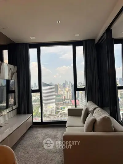 Luxurious living room with stunning city view through large windows, modern sofa and sleek decor.