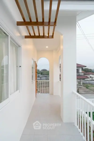 Charming balcony with modern design and scenic view in a stylish residential property.