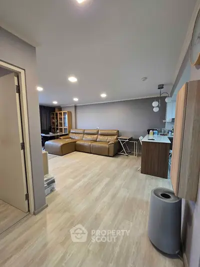 Spacious modern living room with open kitchen and stylish decor
