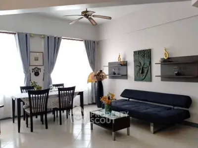 Spacious living room with elegant dining area and modern decor
