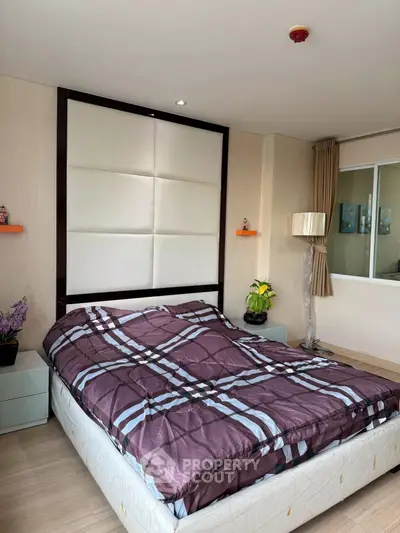 Cozy bedroom with modern decor and large bed in stylish apartment