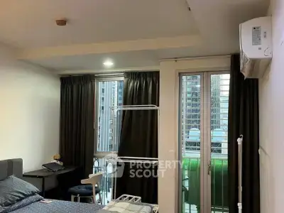 Modern bedroom with balcony view in urban apartment