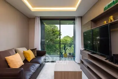 Modern living room with sleek furniture and large glass doors opening to a lush balcony view.