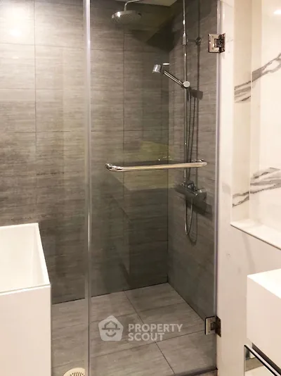 Modern bathroom with sleek glass shower and elegant tile design