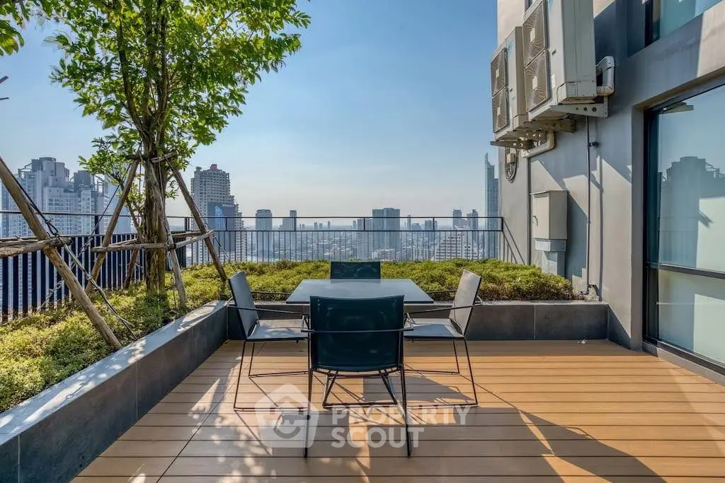 Stunning rooftop terrace with city skyline view and modern outdoor seating.