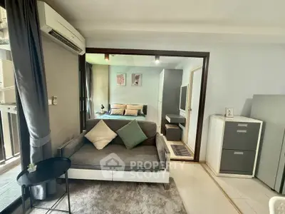 Modern living room with cozy sofa and stylish decor in a contemporary apartment.