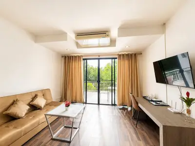 Spacious living room with modern decor and balcony view