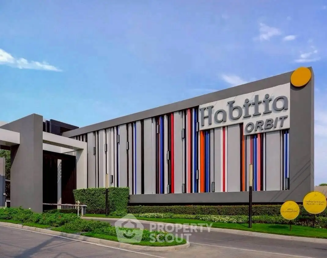 Modern building exterior with colorful facade and stylish design.