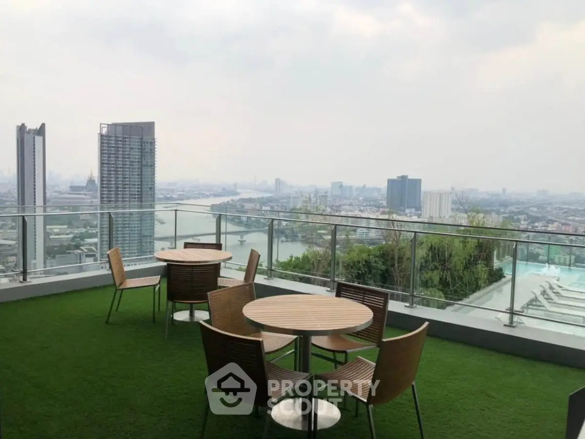 Stunning rooftop terrace with panoramic city views and modern outdoor seating.