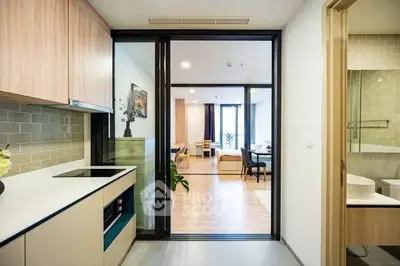 Modern open layout kitchen and living room with sleek design