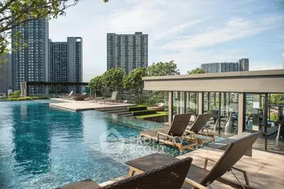 Luxurious rooftop pool with stunning cityscape views and modern lounge area.